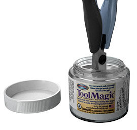 Pliers being dipped in a jar of tool magic